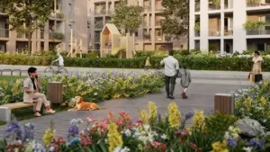 Persone che passeggiano e si rilassano in un parco urbano fiorito, circondato da edifici moderni